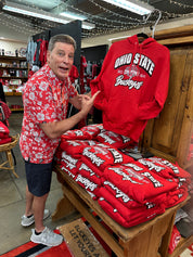 Steve holding sweatshirt