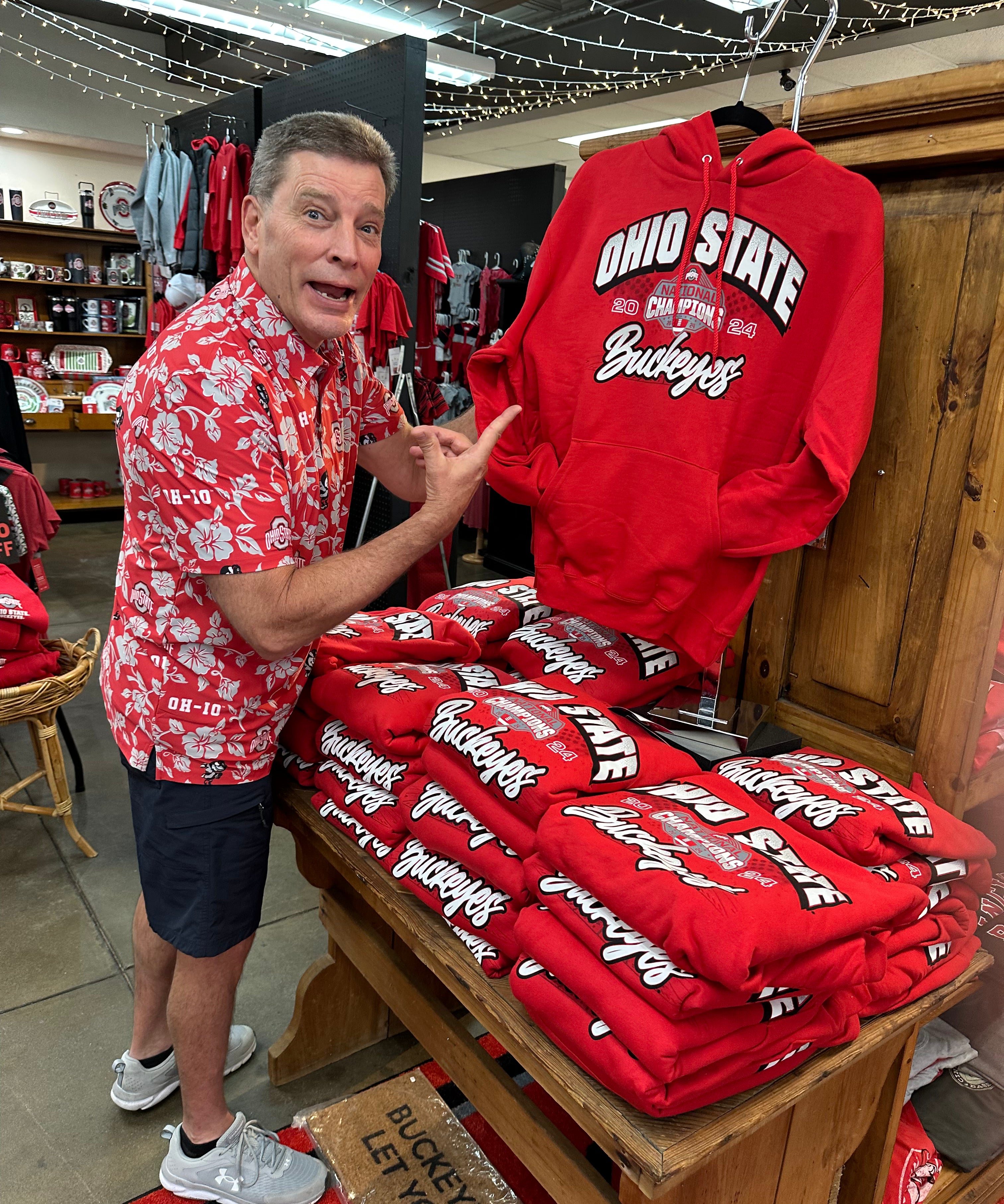 Steve holding sweatshirt