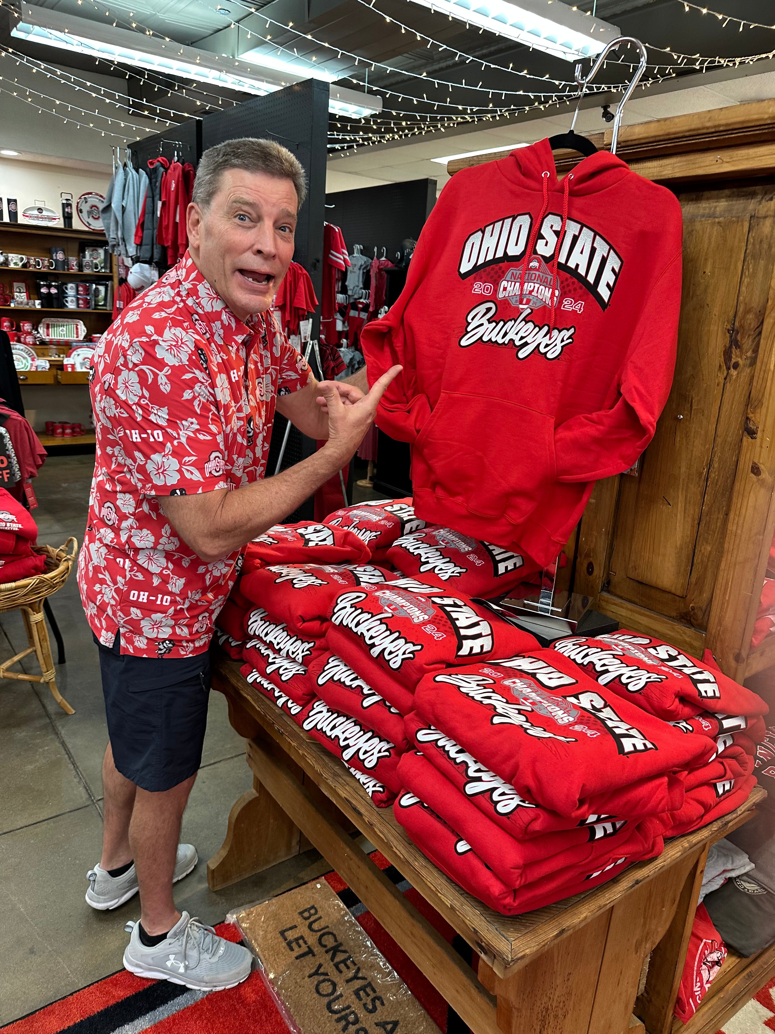 Steve holding sweatshirt