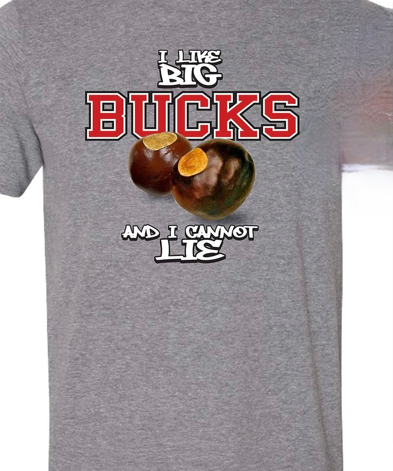 A heather gray short-sleeve t-shirt featuring a graphic print of two chestnuts with the text 'I LIKE BIG BUCKS AND I CANNOT LIE' in white and red lettering.