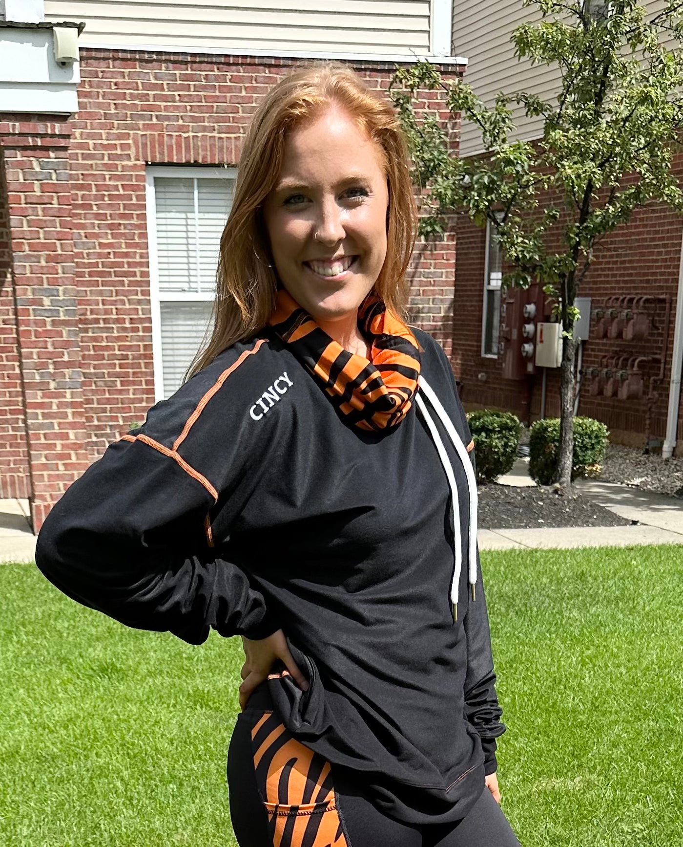 "CINCY" logo under shoulder seam