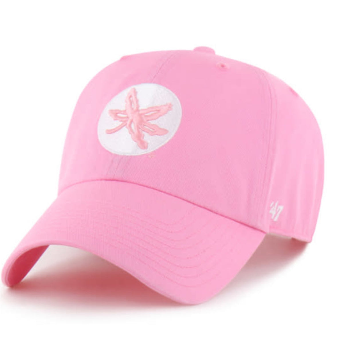 A pink baseball cap featuring a white circular patch on the front with a pink ribbon design, and a white embroidered '47' logo on the side, set against a plain white background.
