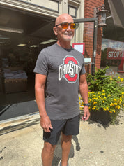 staffer wearing shirt outside of store