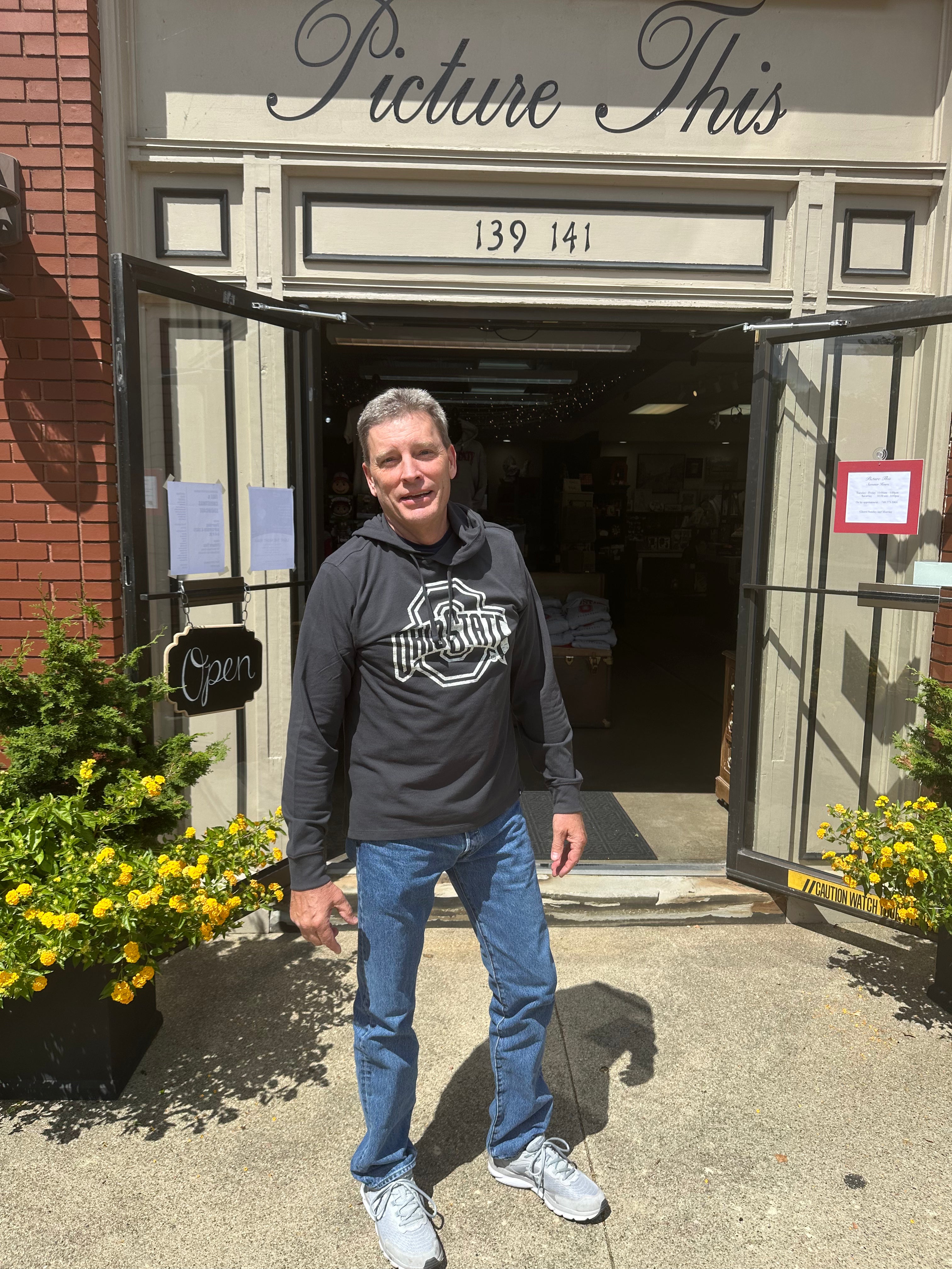 staffer wearing sweatershirt