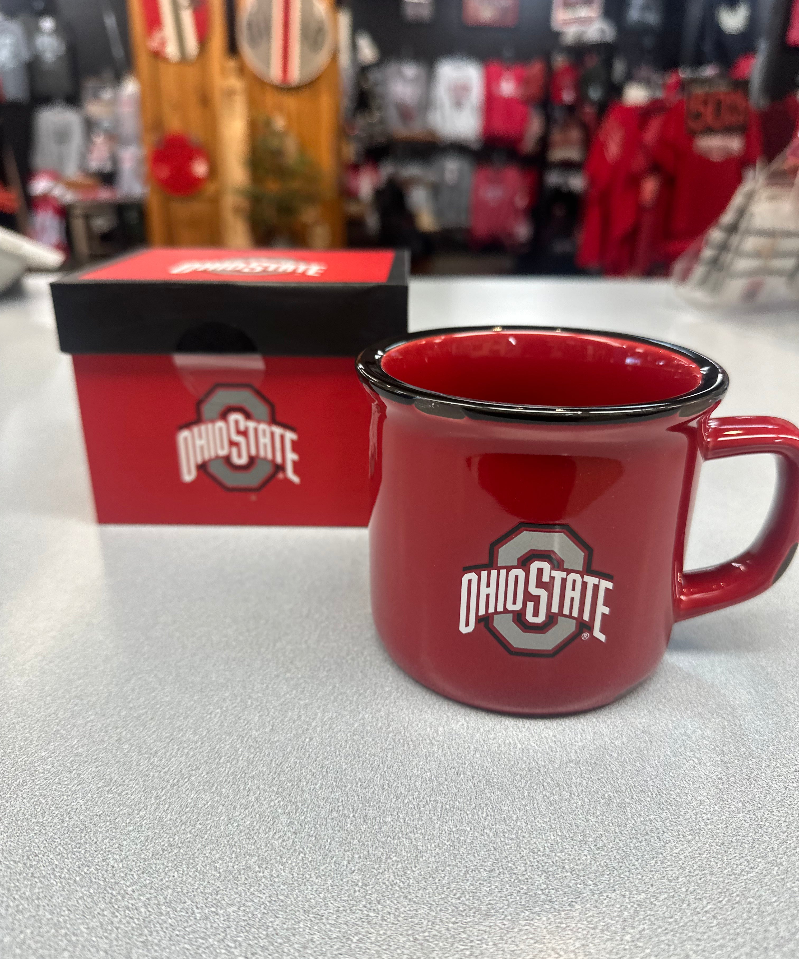 gift box next to cup Durable enamel finish red cup