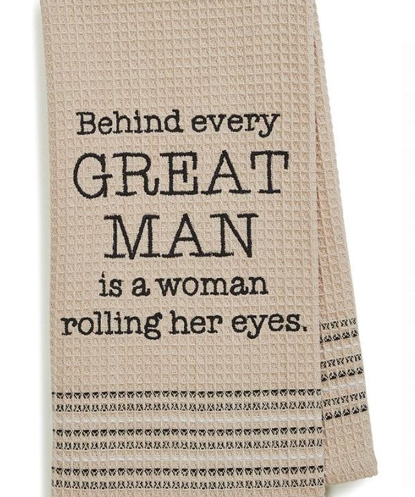 Beige towel with humorous text on a white background