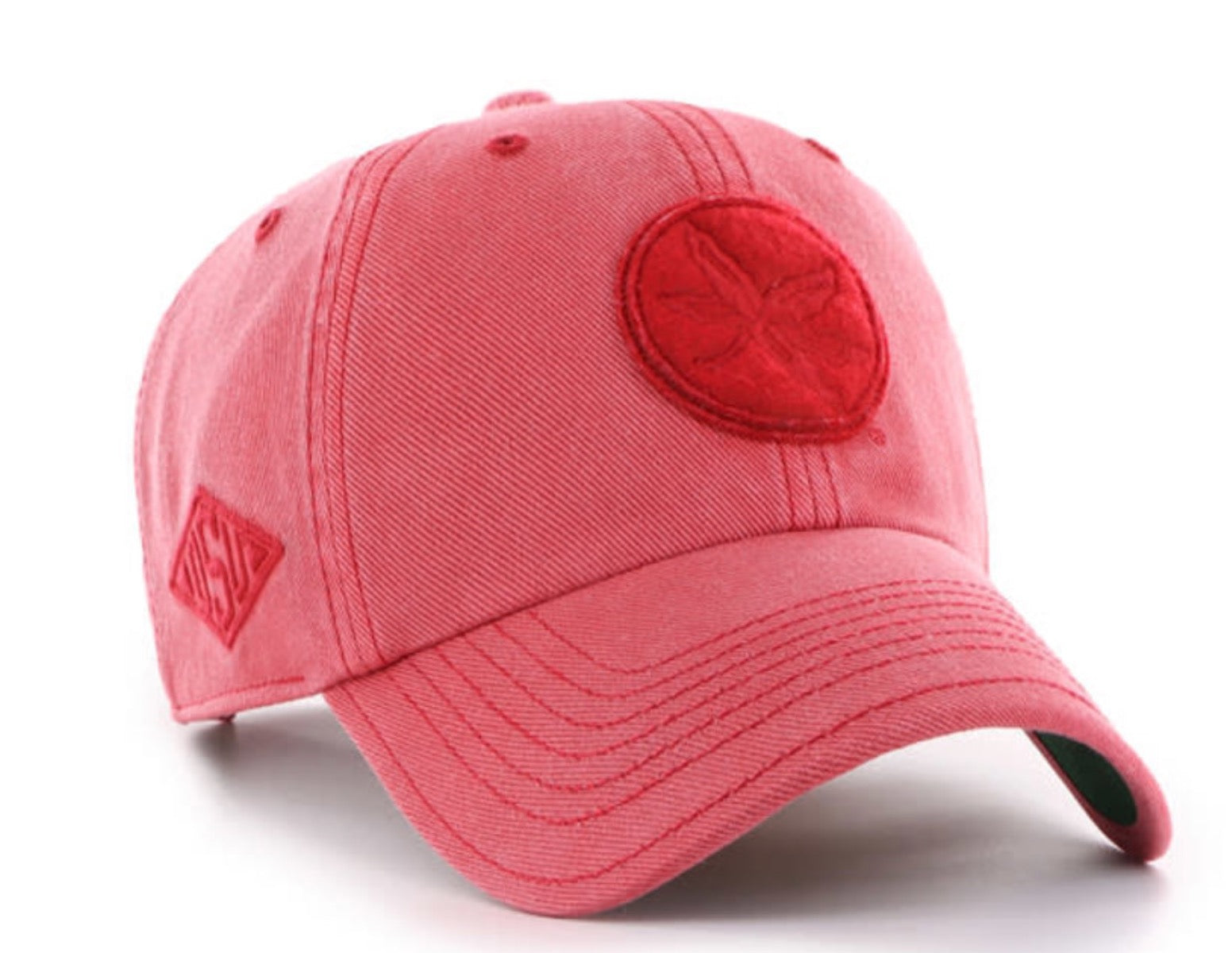 Pink baseball cap with a red circular logo on a white background