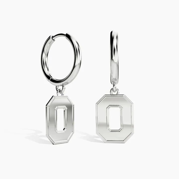 A pair of silver hoop earrings with hanging octagonal letter 'O' charms, shown on a clean white background.