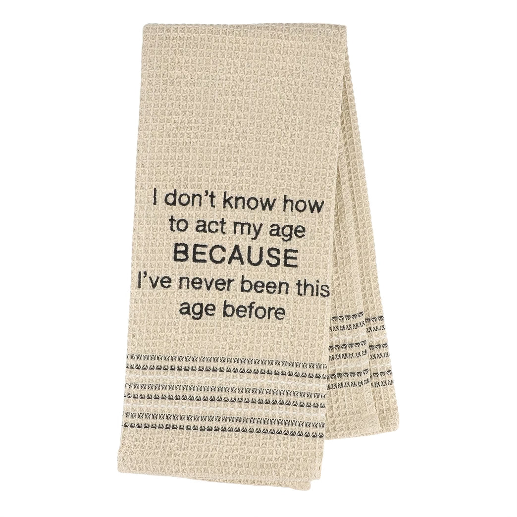 Beige towel with black text on a white background