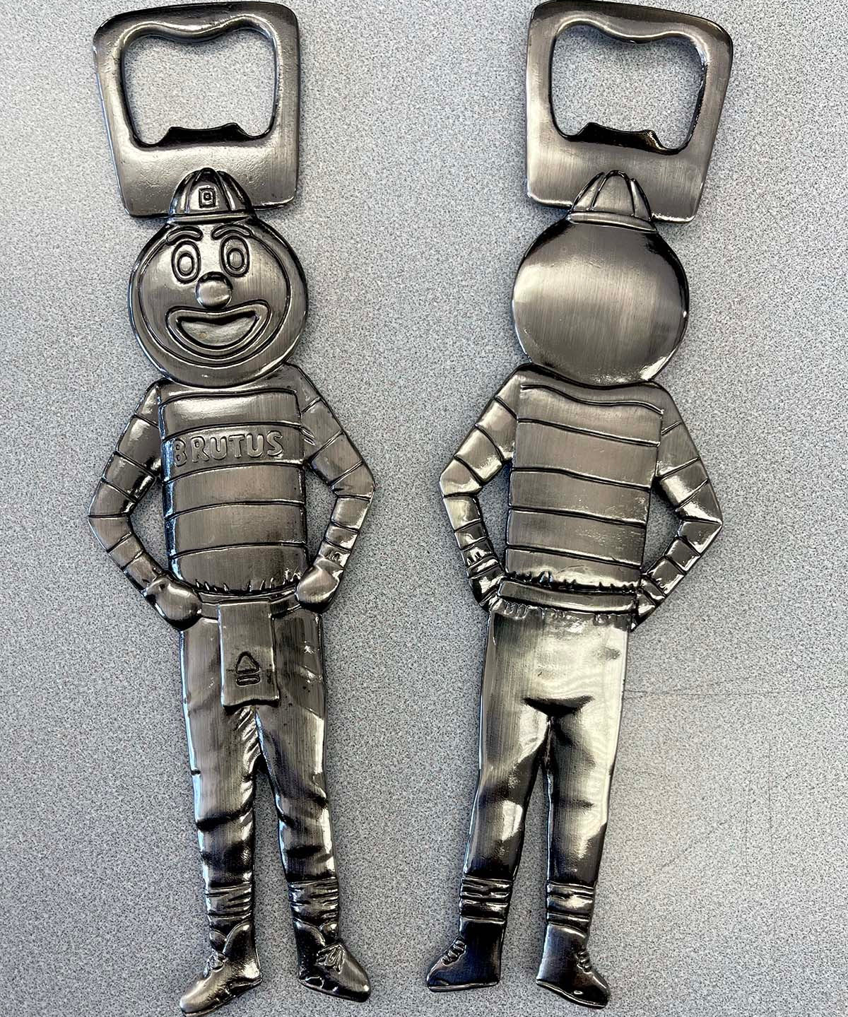 Front and back of BRUTUS PEWTER BOTTLE OPENER